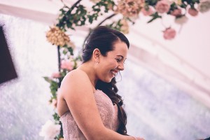 Bride in ceremony putting on ring