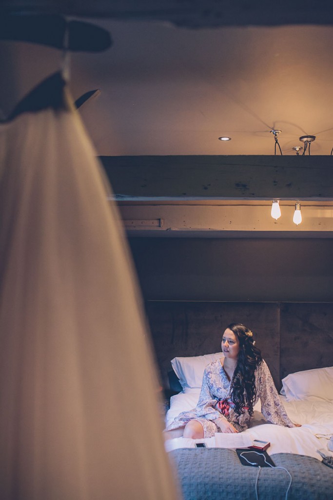 Bride sitting on bed
