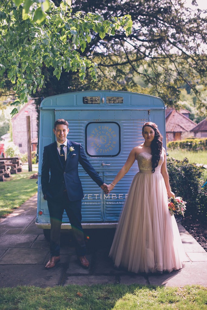 Couple portrait in front of blue van