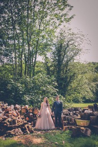 Couple portrait by chopped wood