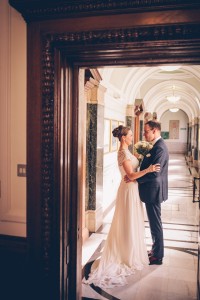 Bride and groom portrait in corridor
