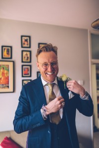 Best man affixing button hole