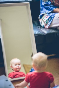 Child looking at reflection