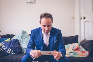 Groom reading wedding card