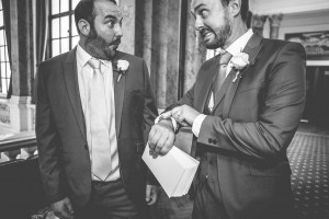 Groomsmen looking at watch