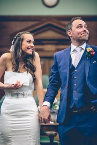 Bride and groom with marriage certificate