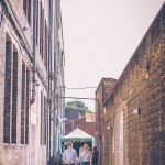 Couple walking down narrow street