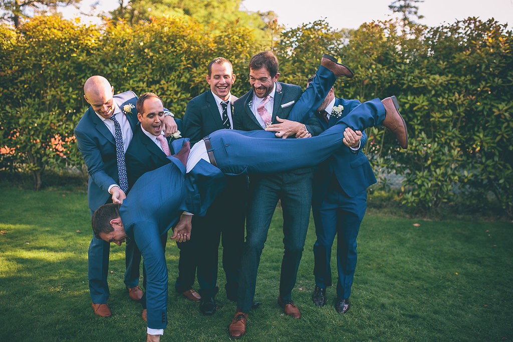 Groom being dropped by friends