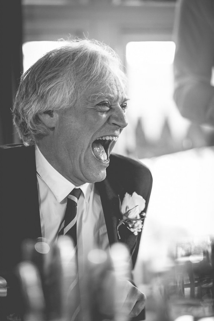 Father of the bride laughing