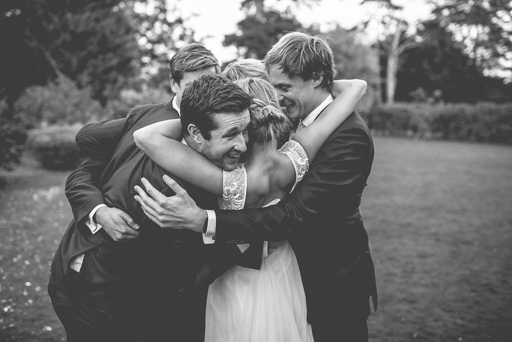 Bride hugging friends
