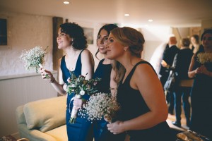 Bridesmaids looking out of window