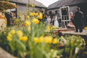 Couple with guests in courtyard