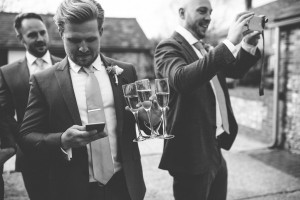 Groom with drinks in hand