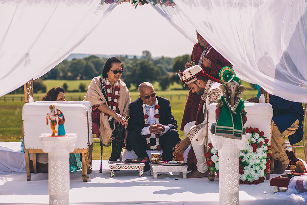 groom in mandap micklefield hall multicultural wedding